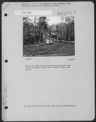 Thumbnail for Consolidated > Men of the 38th Bomb Group unloading supplies from a boat at 30-mile strip, Port Moresby, Papua, New Guinea.