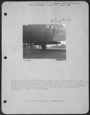 Thumbnail for Consolidated > By slinging the wing of a P-47 Thunderbolt fighter plane to the underside of a C-47 Douglas transport, members of a service squadron at a New Guinea base of the 5th AF Service Command have accomplished an engineering feat believed to be the first of