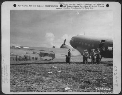 Thumbnail for Consolidated > Men of the Australian 7th Division unload supplies from Douglas C-47's at Nadzab Airstrip, New Guinea, 11 September 1943.