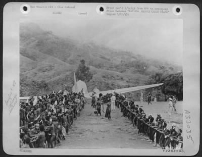 Thumbnail for Consolidated > NATIVES RESCUE CARGO PLANE-When this Douglas C-47 plane of Major General St. Clair Streett's 13th Air Force crash-landed somewhere in the New Guinea jungle, far form the nearest American airdrome, chances of salvage seemed slim. But the chief