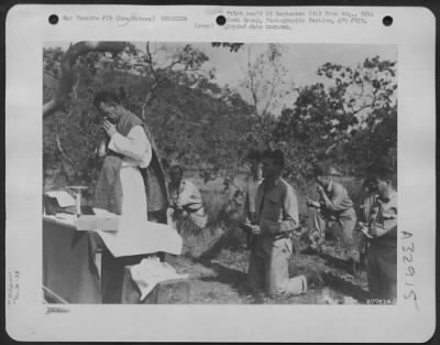 Thumbnail for Consolidated > Men of the 38th Bomb Group attend a Catholic mass held on Christmas Day, 1942, in New Guinea.