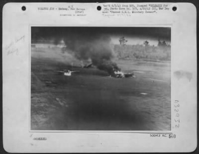 Thumbnail for Consolidated > Japanese aircraft blazing on Madang airdrome during Friday's, April 9, 1943, combined strafing attack by American Mitchells and RAAF Beaufighters. This remarkable picture was taken from a Beaufighter attacking at ground level. Movement in the picture