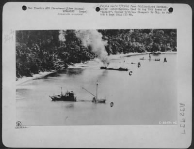 Thumbnail for Consolidated > Four down. All ships are sunk after attack by Douglas A-20s at Manokwari, New Guinea on 9 June 1944. From 4 to 10 June 1944, at this port, 25 barges and luggers met a similar fate.