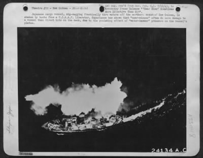 Thumbnail for Consolidated > Japanese cargo vessel, zig-zagging frantically thru waters off the northern coast of New Guinea, is shaken by bombs from a U.S.A.A.F. Liberator. Experience has shown that "near-misses" often do more damage to a vessel than direct hits on the deck