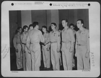 Thumbnail for Consolidated > Lt. Col. Boebel of the First Air Commando Group distributing Distinguished Flying Crosses to W.E. Hitt; Ralph E. Horton; Willie P. Jones; and Miles E. Kemp.