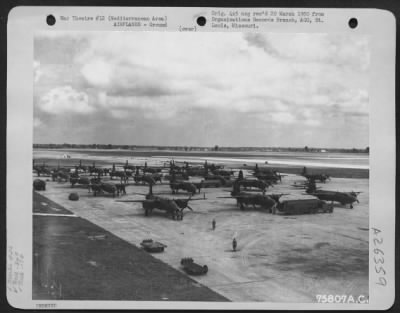 Thumbnail for Consolidated > Martin B-26s of the 34th Bomb Squadron, 17th Bomb Group, parked on the runway at an airfield somewhere in the Mediterranean Area.