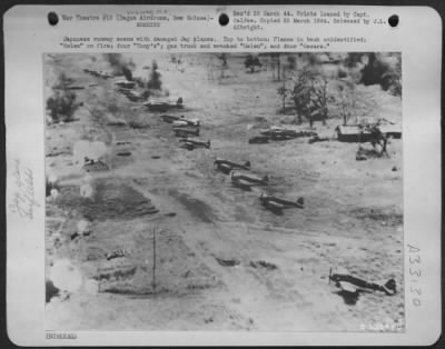 Thumbnail for Consolidated > Japanese runway scene with damaged Jap planes. Top to bottom: Planes in back unidentified; "Helen" on fire; four "Tony's"; gas truck and wrecked "Helen"; and four "Oscars."