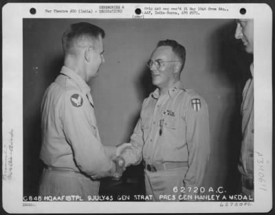 Thumbnail for Consolidated > Lt. General George E. Stratemeyer congratulates Major General Thomas J. Hanley, Jr., after presenting him with the Air Medal at a base in India on 9 July 1945.