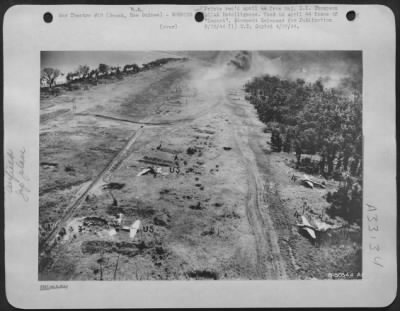 Thumbnail for Consolidated > Final stage of bombing run of Dagua Airdrome, Wewak, New Guinea. Jap planes are (4) Lily. Unservicable planes are marked U.S.