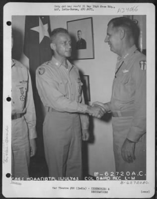 Thumbnail for Consolidated > Lt. General George E. Stratemeyer congratulates Lt. Col. Baird after presenting him with the Legion of Merit at an airbase in India on 11 July 1945.