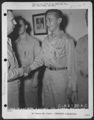 Thumbnail for Consolidated > Lt. General George E. Stratemeyer congratulates Colonel Gapen after presenting him with the Legion of Merit at an airbase in India on 11 July 1945.