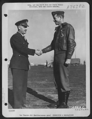 Thumbnail for Consolidated > Major General Nathan F. Twining, Commanding General of the 15th Air Force, congratulates Lt. Col. Robert L. Baseler, Boston, Mass., after presenting the pilot with the Silver Star at an air base in the Mediterranean Area.