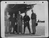 Thumbnail for Crew of the Martin B-26 "Fiddle, Benito While Rome Burns!" of the 34th Bomb Squadron, 17th Bomb Group pose beside their plane at an airfield somewhere in the Mediterranean Area. - Page 1