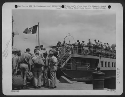 Thumbnail for Consolidated > Lucky Mediterranean Allied Air Forces airmen with orders for a 7 day leave on Capri, board the tiny steamer that makes a daily trip to and from the island from the mainland.