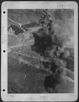 Consolidated > In three heavy attacks, Gen. MacArthur's bombers demolished or irreparably damaged 288 enemy planes on Japanese airfields at Hollandia. As huge clouds of black smoke mark smashed planes, more bombs fall away.