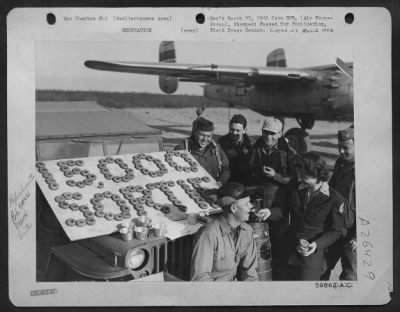 Consolidated > When this North American B-25 Mitchell crew landed at its home base after an attack on the Brenner Pass Line, members were greeted by this original sign made with doughnuts commemorating their flight as the 15,000th sorties flown by the 310th Bomb