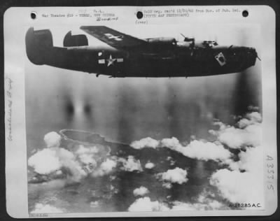 Consolidated > "The Ace of Spades," one of General Kenney's Fifth Air Force Liberator Bombers, soars over Wewak after a devastating attack on a major enemy air base on the North coast of New Guinea.