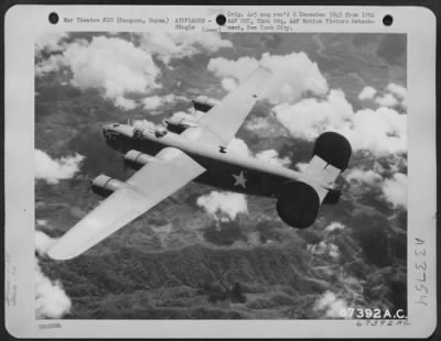 Consolidated > Rugged Terrain Slips By As A Consolidated B-24 Of The 7Th Bomb Group Stationed At Pandaveswar Army Air Base, India, Approached The Target At Rangoon, Burma. 1943.