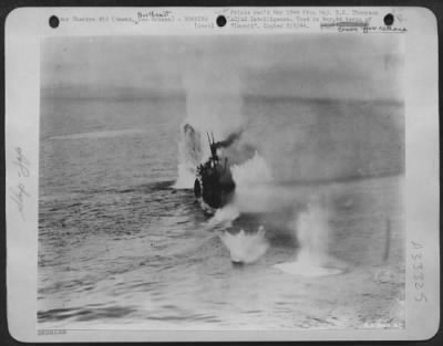 Thumbnail for Consolidated > Near misses are shown on 4000 ton Jap troopship as Douglas A-20s continue masthead assaults. Three-inch forecastle guns are silenced and the Japs are vainly trying to lower lifeboat.