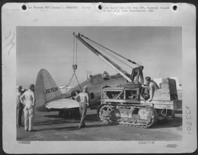 Thumbnail for Consolidated > Tail Of Republic P-47 Is Hoisted Into Bore-Sighting Position By Armorers Of The First Air Commando Group Somewhere In India.  Left To Right:  Sgt. Jack M. Kubler, 26 W. Maple St., Allendale, N.J., Cpl. Robert W. Bowers, 947 Cartaret Ave., Trenton, N.J.; L