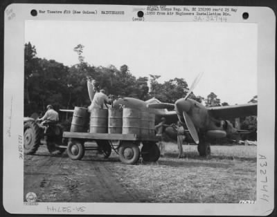 Thumbnail for Consolidated > Men Are Shown Refueling Belly Tank Of A Lockheed P-38.  These Planes Are Seen Somewhere In New Guinea.  28 February 1943.