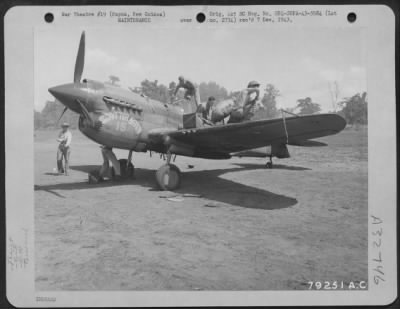 Thumbnail for Consolidated > Ground Crew Of The 7Th Fighter Group At Dobodura, New Guinea, Cleans Off Oil And Reloads The Guns With Ammunition On A Curtiss P-40 Just Returned Frm Combat With Attacking Japs.  The Oil Came From One Of The Zeros The Pilots Show Down.  When The Zero Was