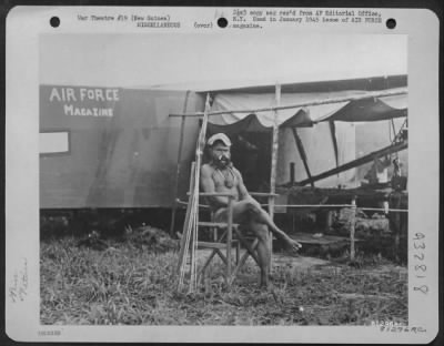 Thumbnail for Consolidated > During The Construction Of Eunice Airstrip In New Guinea, Native Labor Was Recruited To Help Build The Strip.  Proving That He Can Go Along With Cibilization, The Kukukuka Native Acquired A Fatigue Cap From A Mechanic And Sat Himself In A Chair.