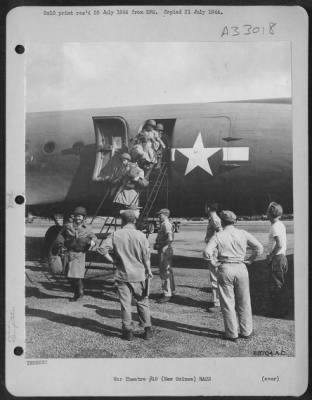 Thumbnail for Consolidated > Gi'S Look On As The First Members Of The Women'S Army Corps To Be Assigned To Duty In New Guinea Step Down From The Plane Which Brought Them To This Tropical Island.