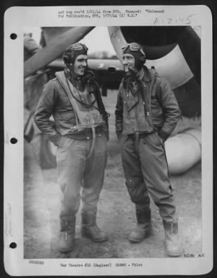 Fighter > ENGLAND-BACK FROM GREATEST ATTACK-Two Eighth Air force fighter pilots who participated in the history-making attack of 20 February, against German fighter aircraft industry, shown talking it over after fighters had returned to base after destroying