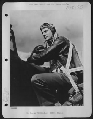 Thumbnail for Fighter > 2nd Lt. Bernard Smith, 511 Durston Avenue, Syracuse, New York, of the 63rd Fighter Squadron, 56th Fighter Group, climbs into the cockpit of his plane at an air base in England.