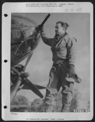 Thumbnail for Fighter > Capt. William L. Leirevaag, 308-136 Place, Chicago, Ill., uponn returning from a rough trip to Chiefres, Belgium, stands by the gun with which he downed one Nazi fighter and probably destroyed another. The encounter took place after bombing the target