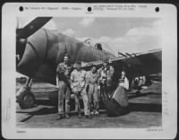 Thumbnail for Col. Gabreski poses with his ground crew for a picture just after returning from a mission over France. The Col. Is commanding officer of his squadron, is the leading Ace of the USAAF with 28 German planes to his credit. He hold the Air Medal with 3 - Page 1