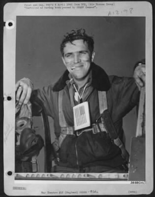 Thumbnail for Fighter > WAR PAINT---Tagged for identification with both the Russian and American ground forces, 2nd Lt. Robert G. Young, Jr., of Midland Park, N.J., pilot of a North American P-51 Mustang, returns from escorting bombers to Berlin, slightly marred but smiling