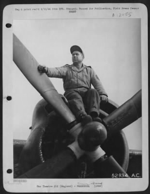 Thumbnail for Ground > T/Sgt. Lawrence Cutheil, Lower Salem, Ohio, stops his work long enough to have his picture taken atop one of the mighty engines of "Son of Satan."