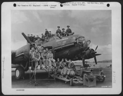 Thumbnail for Ground > The air crew, ground crew and armourers of "Hell's Angels," a Boeing B-17 Flying ofrtress, operating from England. Major Kirk R. Mitchell, Oklahoma City, Oklahoma, Commanding Officer of the Squadron is in the jeep. The quiet looking little job on