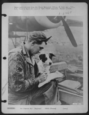 Thumbnail for Ground > S/Sgt. Victor B. Klonowsky, Apollo, Pa., a hydraulic and engine expert with the service group writes out a report of the work he just finished on a plane while "Bob" the group mascot stands by.