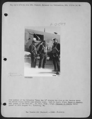 Thumbnail for Gunner > Crew members of the Liberator "Patsy Ann II" discuss the blow at the beaches where the allied troops landed some minutes later. Left to right: S/Sgt. Tyrus J. Shanley, tail gunner of 505 Cass Ave., St. Paul, Minn., S/Sgt. Chauncey H. Steele, waist