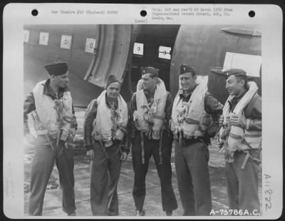 General > A Douglas C-47 Crew Of The 439Nd Troop Carrier Pose In Front Of Their Plane At An Airbase Somewhere In England.  9 July 1944.