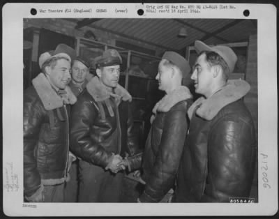 General > Colonel Joesph Nazzaro Of Los Angeles, Calif., Commanding Officer Of The 381St Bomb Group At Ridgewell, England, Congratulates Some Of The Members Of His Group Who Have Completed 25 Operational Missions Against The Enemy.  18 November 1943.