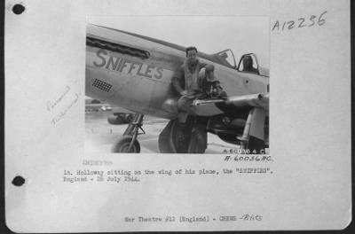 Thumbnail for Fighter > Lt. Holloway Sitting On The Wing Of His Plane The 'Sniffles'.  England 26 July 1944.