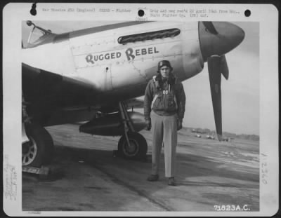 Thumbnail for Fighter > A Pilot Of The 364Th Fighter Group, 67Th Fighter Wing, Poses Beside His North American P-51 'Rugged Rebel' At The 8Th Air Force Station F-375, Honnington, England.  14 October 1944.