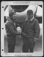 Thumbnail for Major Walter C. Beckham (Left) De Funiak Springs, Fla., And S/Sgt. Henry E. Bush, Jr., Easley, Sc, Discuss Their Latest Mission In Front Of A Republic P-47 At An Air Base Somewhere In England. - Page 1