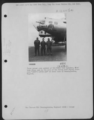 Thumbnail for Ground > Three Ground Crew Members Of The 323Rd Bomb Squadron, 91St Bomb Group Pose By The Nose Of The Boeing B-17 "Flying Fortress" 'Judy`S Little Ass' At Their Base In Bassingbourne, England.