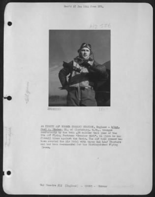 Thumbnail for Gunner > An Eighth Aaf Bomber Command Station, England - S/Sgt. Paul A. Vrabeck, 24, Of Clarksburg, Wv, Lounges Comfortably By The Twin .50 Calibre Tail Guns Of The 8Th Aaf "Flying Fortress" 'Sweater Girl' In Which He Has Flown 25 Times Against The Nazis.  The Aaf