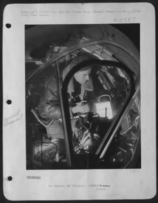 Thumbnail for Gunner > England - Within The Plexiglass-Enclosed Nose Of A Boeing B-17 "Flying Fortress", Pvt. Oliver H. Davis, Westbrook Field, Mass., Makes Last-Minute Adjustments And Loads The Fifty-Caliber Machine Guns Used To Ward Off Swarming German Fighters.  Shortly Afte