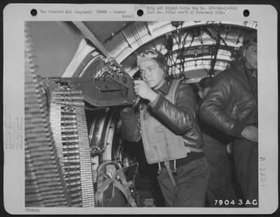 Thumbnail for Gunner > Sgt. Hubert Hayes Of Parkersville, West Virginia, Waist Gunner On The Boeing B-17 "The Bad Penny" Checks His Gun Before Take-Off On A Mission Over Enemy Territory From His Base At Cambridge, England.  6 May 1943.