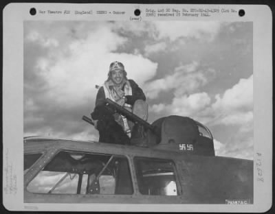 Thumbnail for Gunner > S/Sgt. Jack Levine, East Nassau, N.Y., Top Turret Gunner Of Boeing B-17 "Our Gang" Of The 324Th Bomb Squadron, Bassingbourne, England, Climbs Into His Gun Position Ready For The Ships Take Off On Another Bombing Mission.   June 1943.