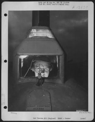 Thumbnail for Gunner > S/Sgt. Merlin D. Miller Of Chicago, Ill., Tail Gunner On A Boeing B-17 Based At Molesworth, England, Is Shown Aiming Through His Gunsight During A Mission Over Enemy Territory.  6 November 1943.