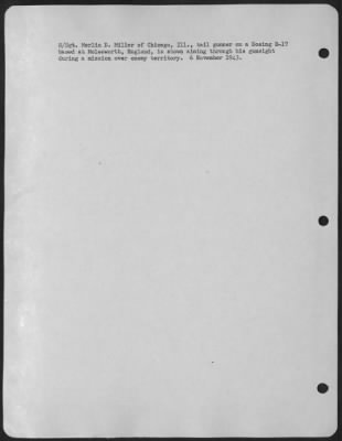 Gunner > S/Sgt. Merlin D. Miller Of Chicago, Ill., Tail Gunner On A Boeing B-17 Based At Molesworth, England, Is Shown Aiming Through His Gunsight During A Mission Over Enemy Territory.  6 November 1943.