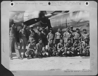 Thumbnail for Consolidated > The Ground And Flight Crew Of Boeing B-29 'Enola Gay' After The First Atomic Bombing Mission On Hiroshima, Japan.  Colonel Paul W. Tibbets, The Pilot, Is In The Center Under The Prop, Wearing Shirt And Cap.  Tinian, Marianas Islands.